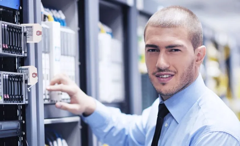 IT technician working on managed IT hosting infrastructure — KMCS IT LLC Dallas Texas